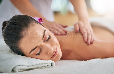 Buy stock photo Cropped shot of an attractive young woman getting an exfoliating treatment at the spa
