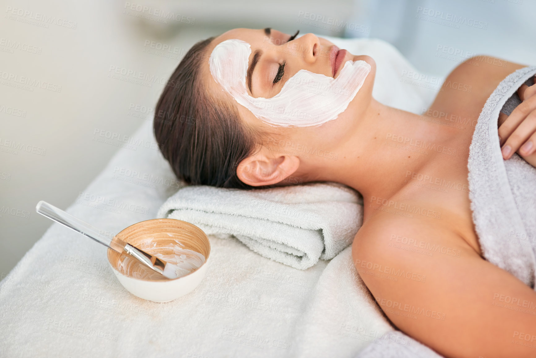 Buy stock photo Woman, skincare and relax with face mask at spa for cleansing detox, beauty and dermatology. Client, peace and bowl with product at luxury resort for natural clay facial, cosmetics and exfoliation