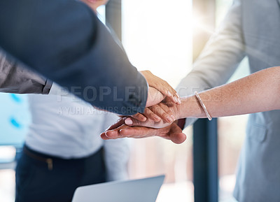 Buy stock photo Cropped shot of a group of unrecognizable businesspeople piling their hands on top of each other in the office