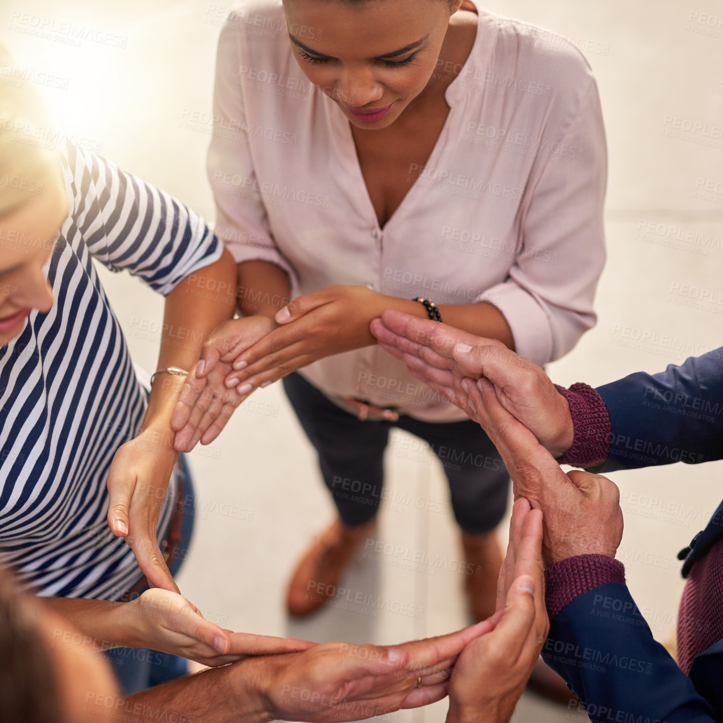 Buy stock photo Arms, circle and huddle with team of business people in office from above for solidarity or unity. Collaboration, hands and support with employee group in workplace for synergy, trust or workflow