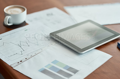 Buy stock photo Cropped shot of paperwork and a digital tablet on a desk in an office