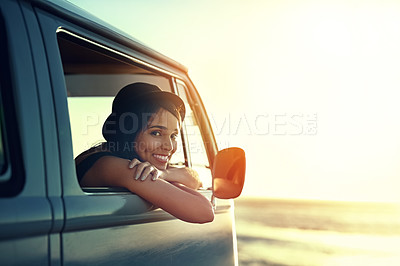 Buy stock photo Shot of a young woman enjoying a relaxing roadtrip