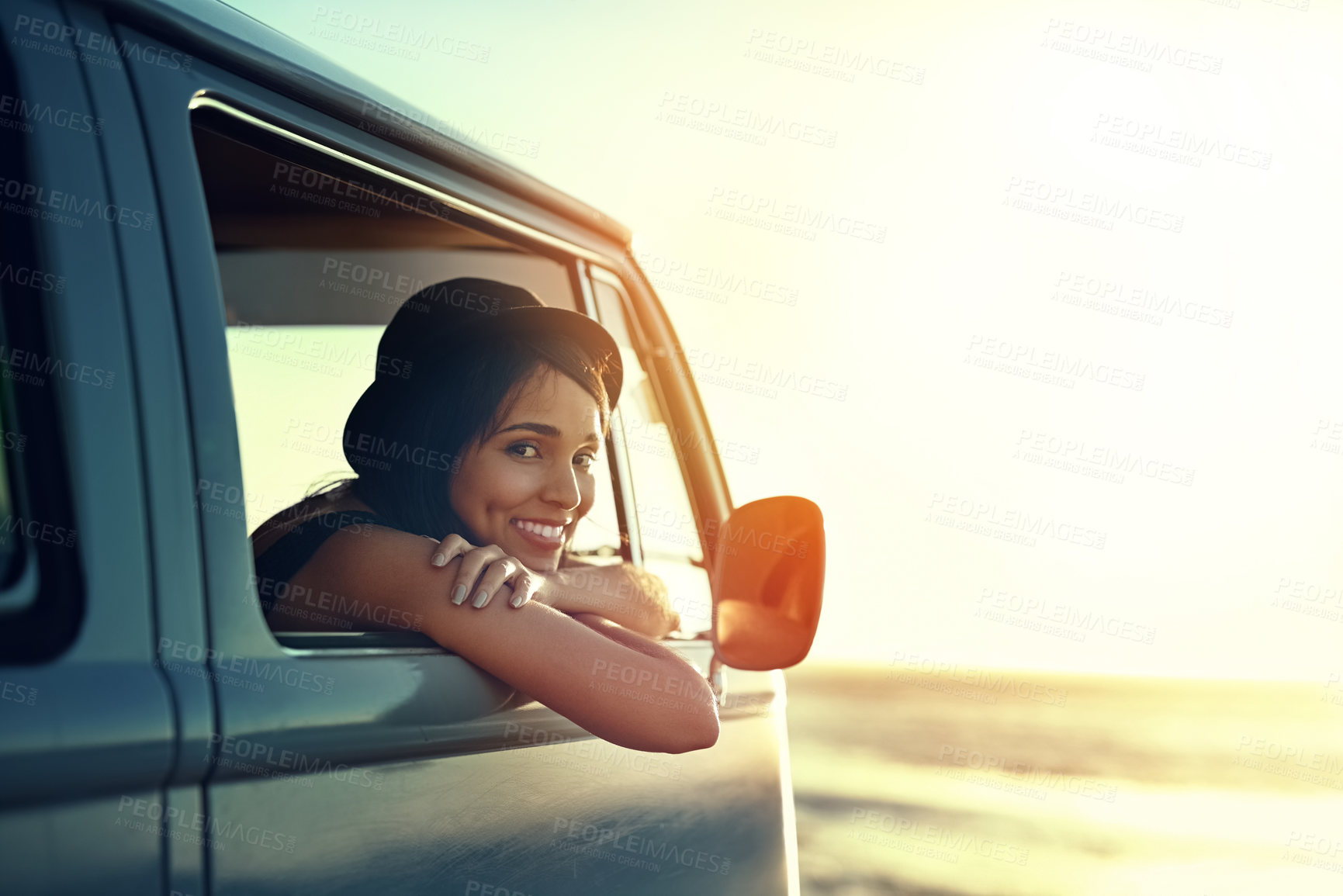 Buy stock photo Shot of a young woman enjoying a relaxing roadtrip