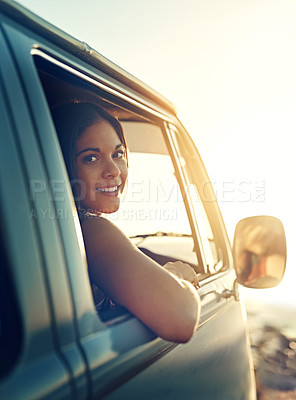 Buy stock photo Shot of a young woman enjoying a relaxing roadtrip