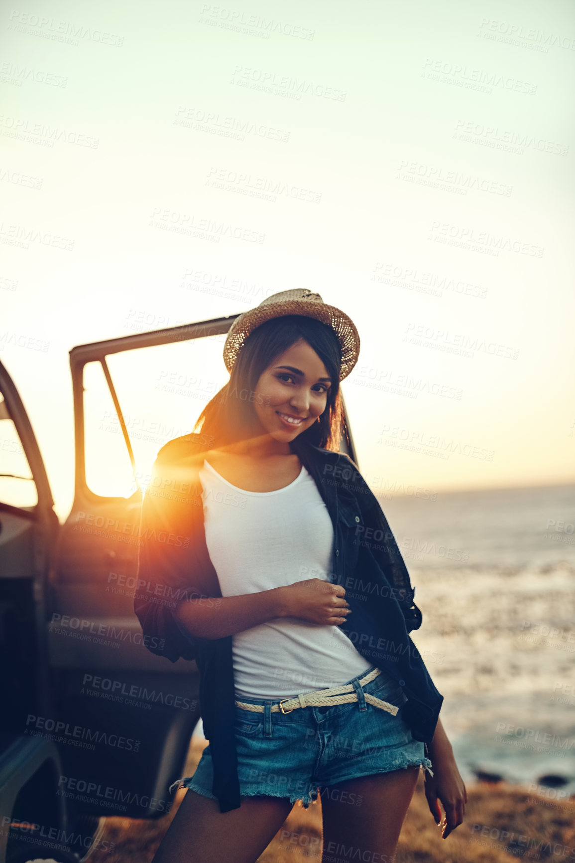 Buy stock photo Car, portrait and road trip with woman at beach at sunset for holiday, travel or vacation in summer. Relax, smile and wellness with happy tourist on coast for drive, getaway or transport to location