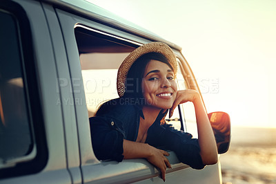 Buy stock photo Shot of a young woman enjoying a relaxing roadtrip