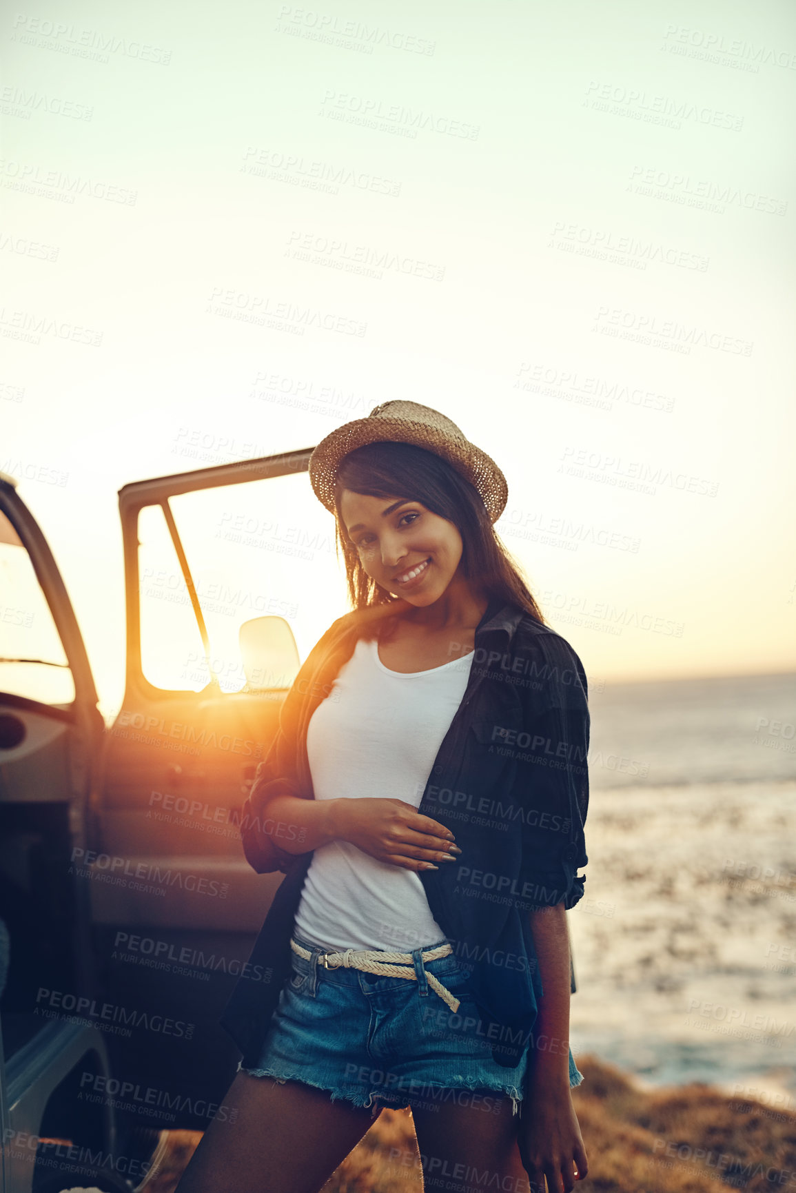 Buy stock photo Shot of a young woman enjoying a relaxing roadtrip