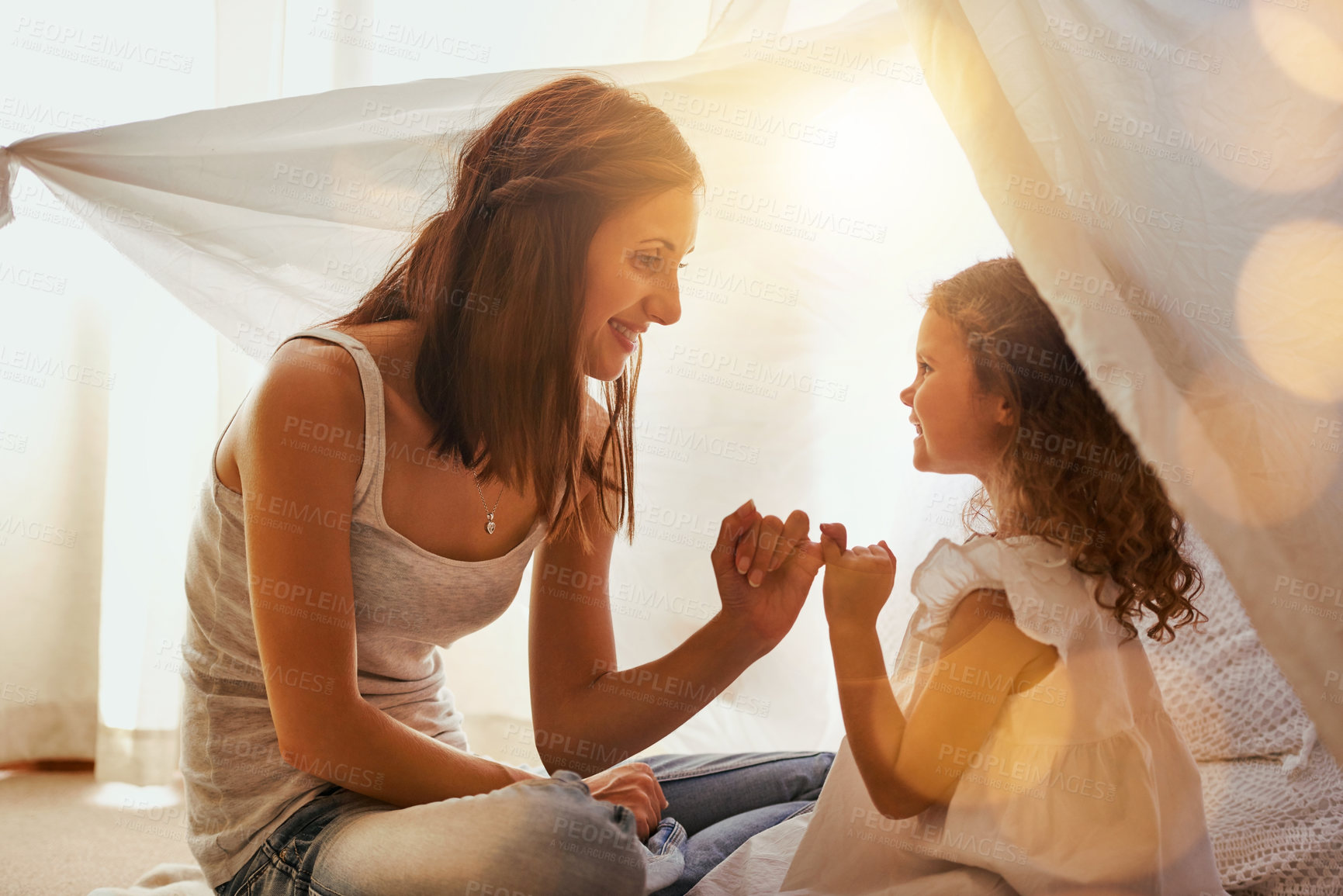 Buy stock photo Shot of a mother and daughter coming together and making a pinky swear as a promise to one another