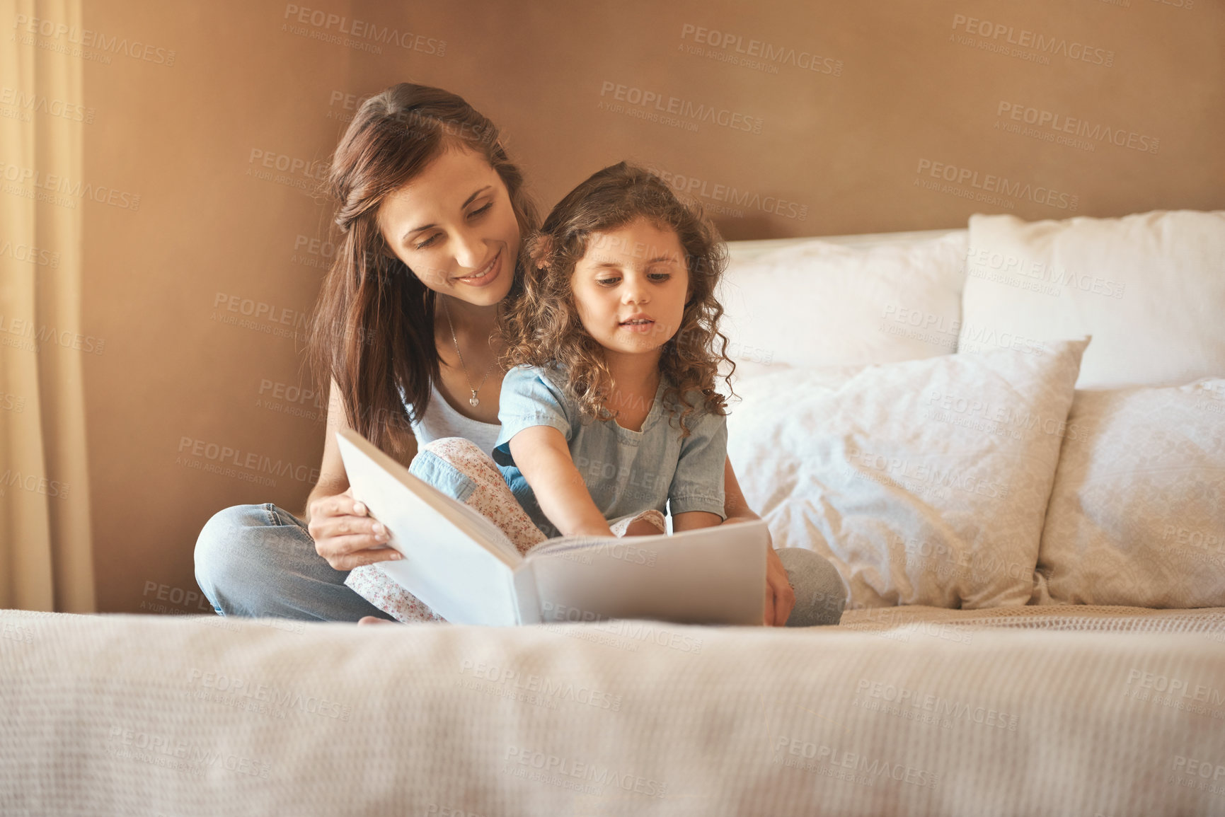 Buy stock photo Bed, mom and child with book, story and bonding for fun, education and love in home. Reading, woman and girl together in bedroom for storytelling, learning and relax with care, growth and development