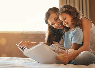 Buy stock photo Bed, mom and daughter with book, smile and bonding for story, education and learning in home. Reading, woman and child in bedroom for storytelling, happy and relax with care, growth and development