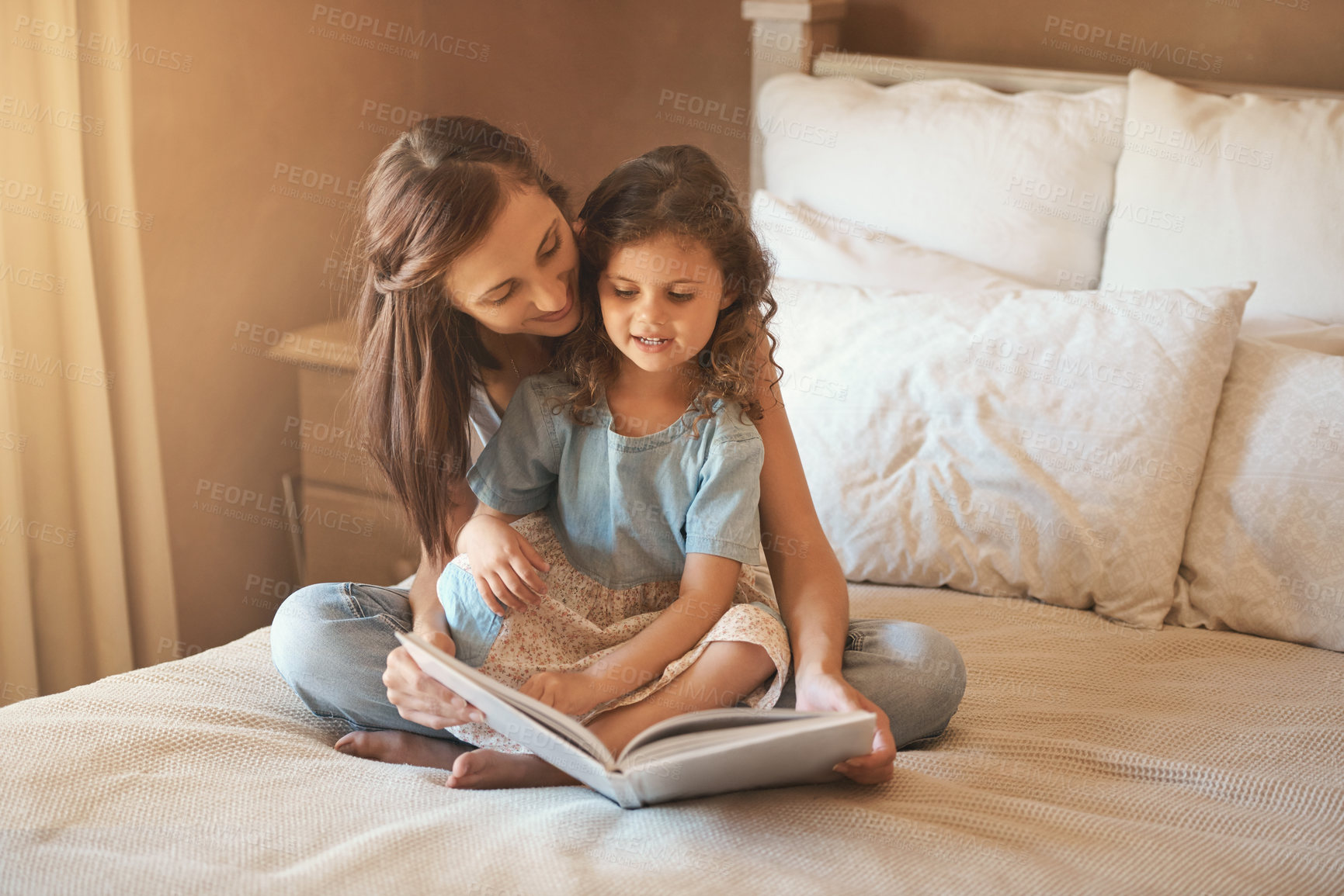 Buy stock photo Bed, mom and child with book, reading and bonding for fun, education and love in home. Story, woman and girl together in bedroom for storytelling, learning and relax with care, growth and development