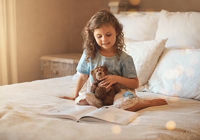 Buy stock photo Smile, book and child reading on bed in home with story, bokeh and teddy bear in the morning. Development, education and youth fairytale with happy kid and literature in bedroom with storytelling