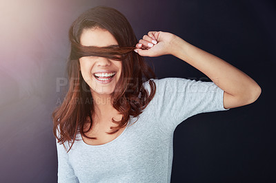 Buy stock photo Woman, haircare and hiding on studio background for silly, comedy and healthy growth or textures. Female person, cover and funny joke for humor, mystery and playful laughing for crazy hairstyle