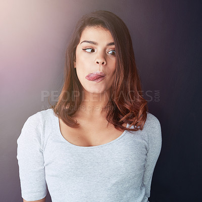 Buy stock photo Silly, tongue out and young woman with funny, comedy and emoji face for prank in studio. Joke, quirky and confidence with student from Italy with comic and goofy look of happy teenager with humor