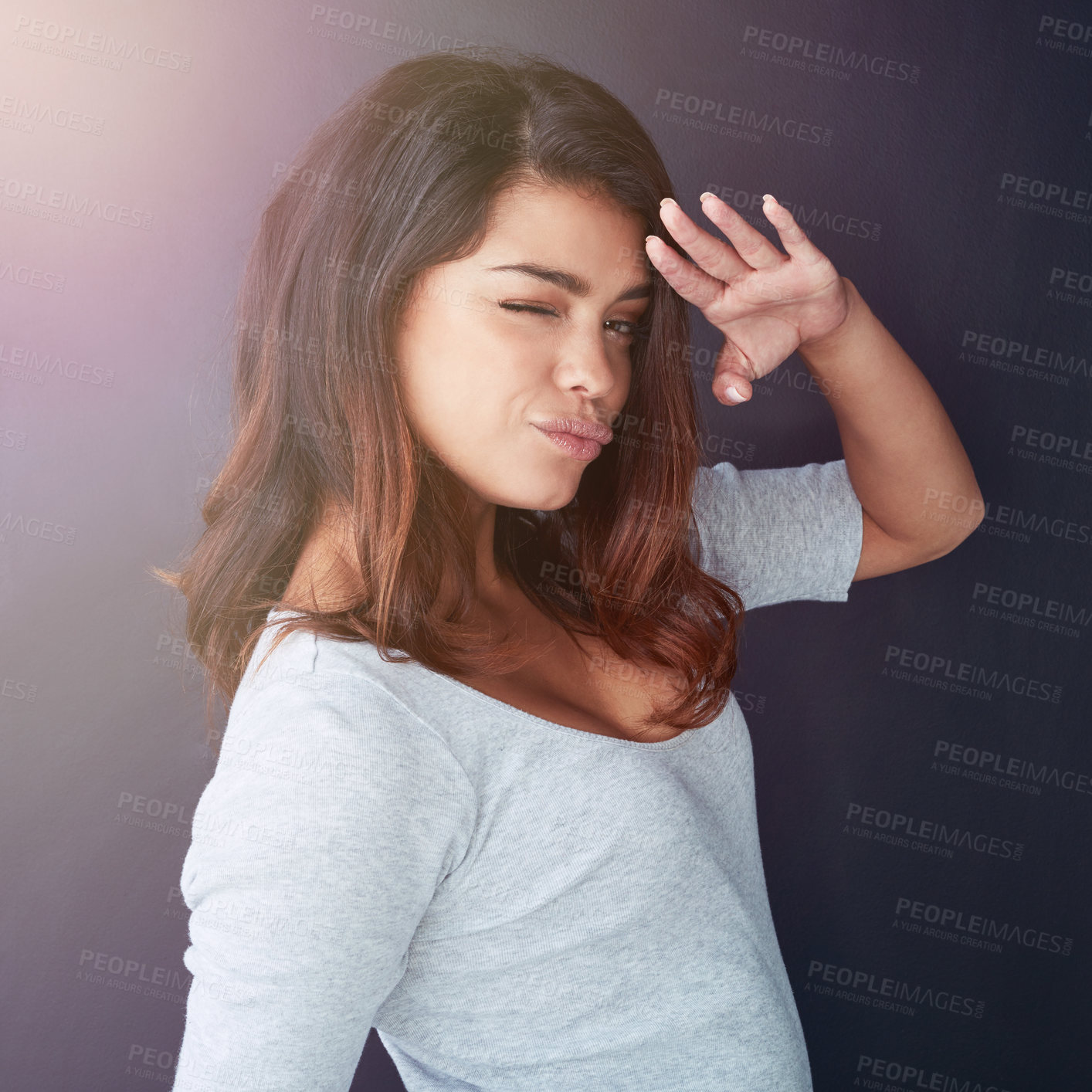 Buy stock photo Woman, beauty portrait and salute in studio with wink for greeting, confidence and flirty attitude. Model girl, emoji face and hello hand sign for respect, motivation and pride by dark background