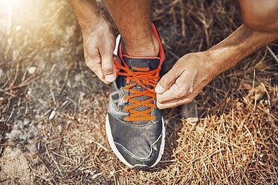 Buy stock photo Man, hands and tying laces with shoes in woods for workout, hiking or outdoor exercise. Closeup of male person or feet in preparation or getting ready for trekking, training or running in nature