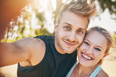 Buy stock photo Shot of a young couple smiling outdoors