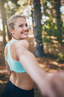 Buy stock photo Personal perspective shot of a young couple walking into the forest