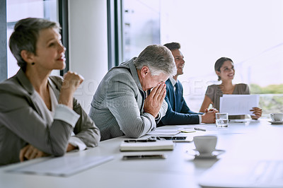 Buy stock photo Cropped shot of a businessman blowing his nose in the boardroom whilst in a meeting