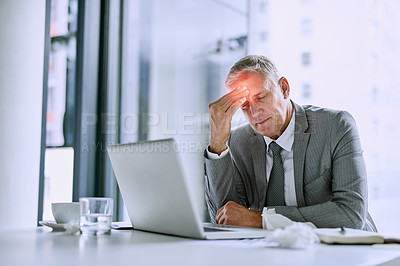 Buy stock photo Cropped shot of a mature businessman suffering with a headache in the office