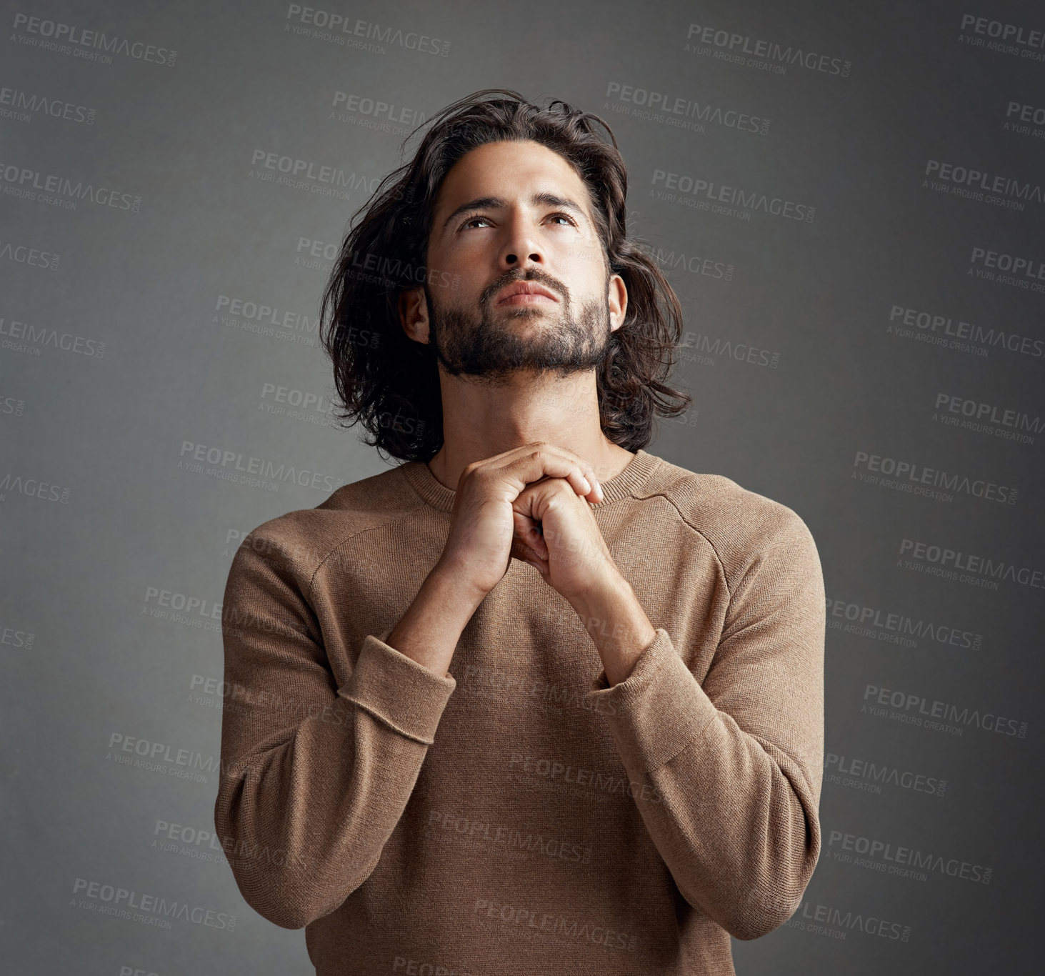 Buy stock photo Man, hands and praying in studio for hope with holy worship, spiritual help and trust in God. Male person, prayer and Christian emoji for gratitude with religion, faith and support by gray background