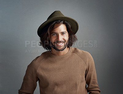 Buy stock photo Portrait, hat and smile of man in studio isolated on a gray background. Face, fedora and handsome male person or model from Australia with happiness for fashion, stylish and trendy aesthetic mockup.