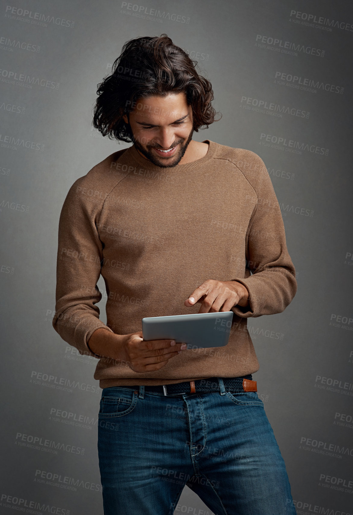 Buy stock photo Tablet, research and happy creative man in studio on grey background for scrolling information. Technology, social media or internet with smile of young website designer using online app to search