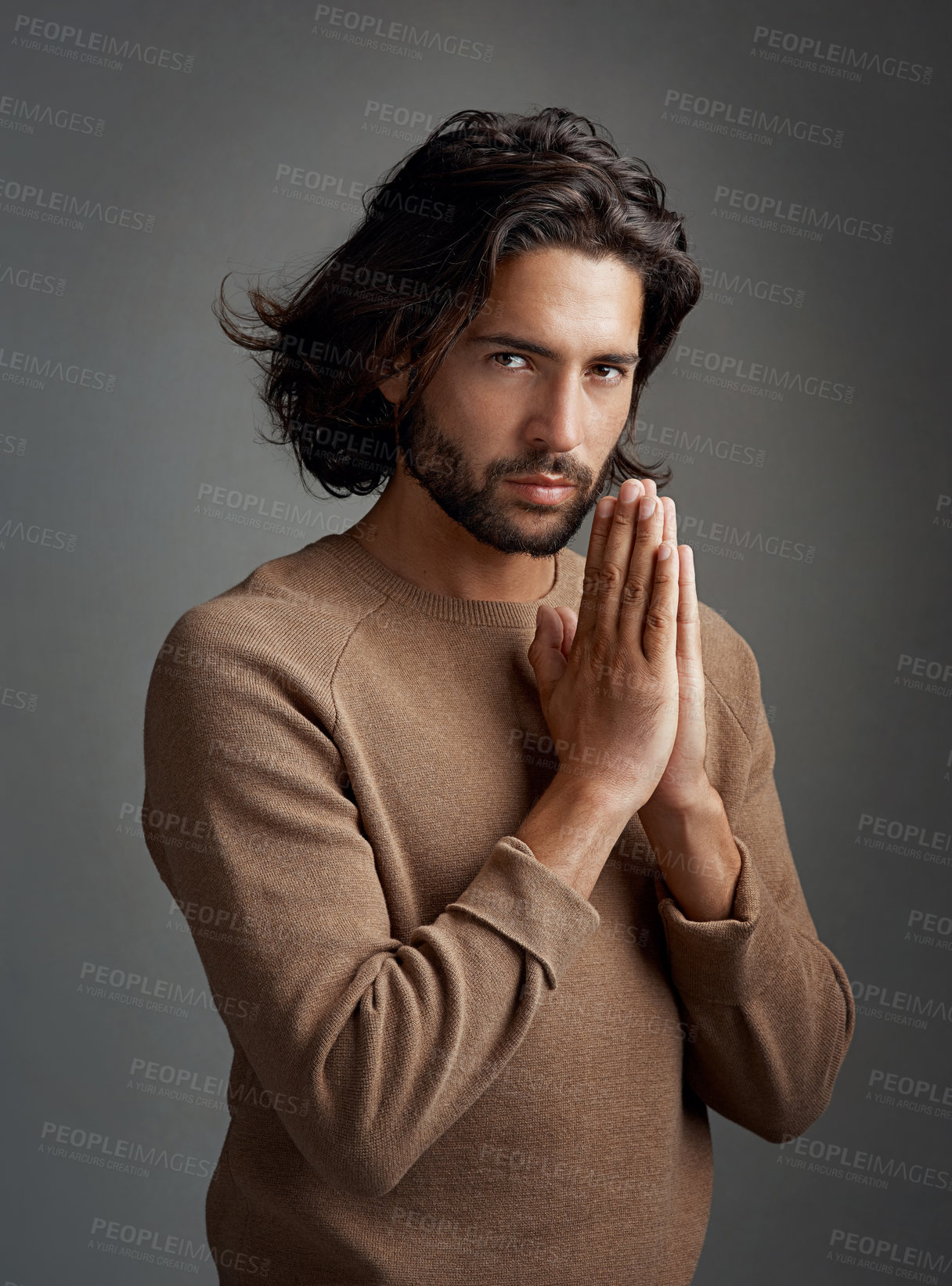 Buy stock photo Man, studio and hands for praying in portrait with respect, religion with gratitude for wellness. Male person, gray background and hope for spiritual zen or praise with kindness, forgiveness with god