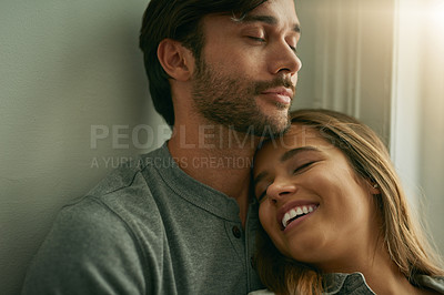 Buy stock photo Shot of an affectionate young couple sharing a peaceful moment