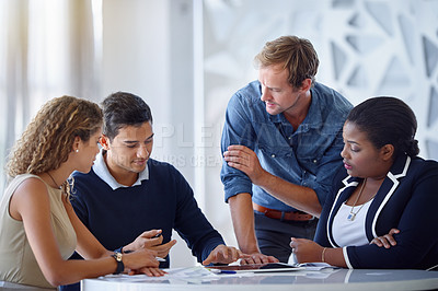 Buy stock photo Shot of a team of businesspeople working together in the office
