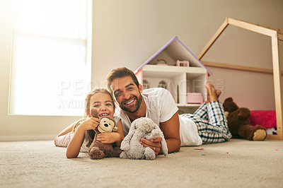 Buy stock photo Portrait of a handsome young man and his daughter playing with stuffed toys on her bedroom floor