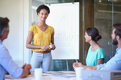 Buy stock photo Cropped shot of an attractive young woman giving a business presentation