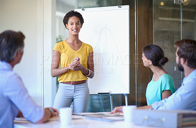 Buy stock photo Cropped shot of an attractive young woman giving a business presentation