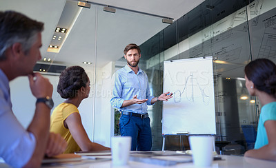 Buy stock photo Cropped shot of a handsome young man giving a business presentation