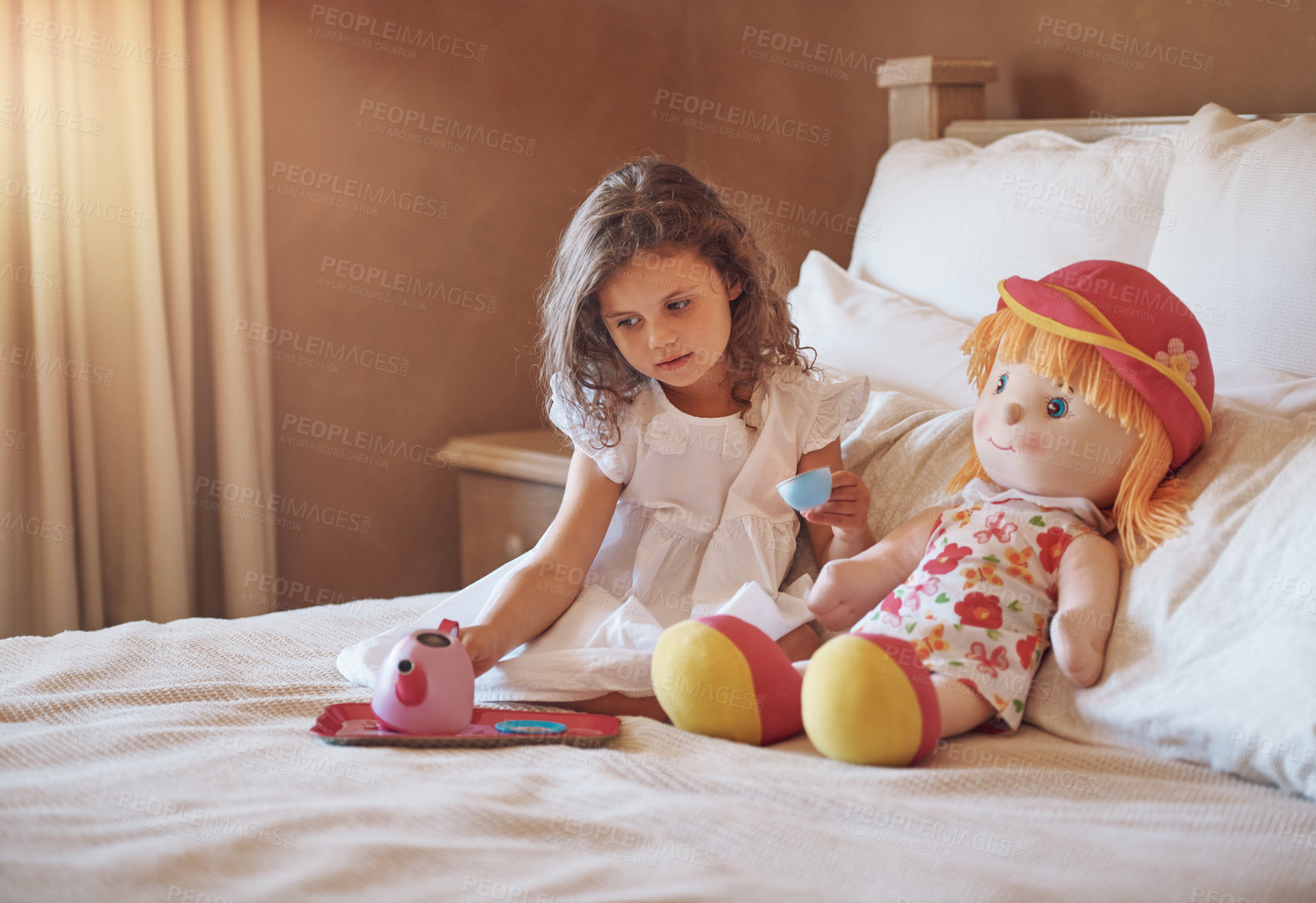 Buy stock photo Tea party, playing and kid with doll in bedroom for imagination, pretend and fun on weekend. Home, little girl and tray with kettle on blanket for creativity, entertainment and child development