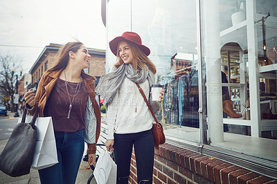Buy stock photo Shot of two young women out on a shopping spree