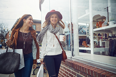 Buy stock photo Shot of two young women out on a shopping spree