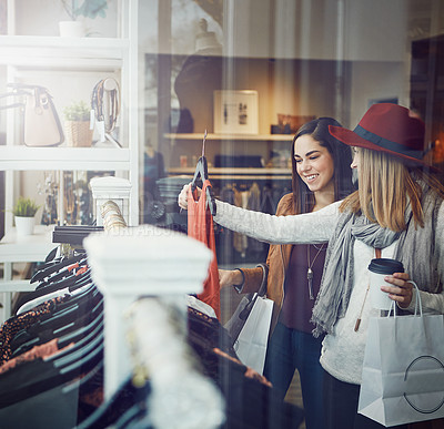 Buy stock photo Shot of two best friends out shopping in a clothing store