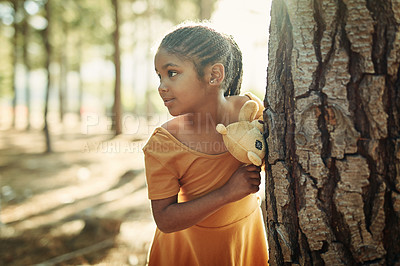 Buy stock photo Shot of a little girl playing in the woods with her teddybear