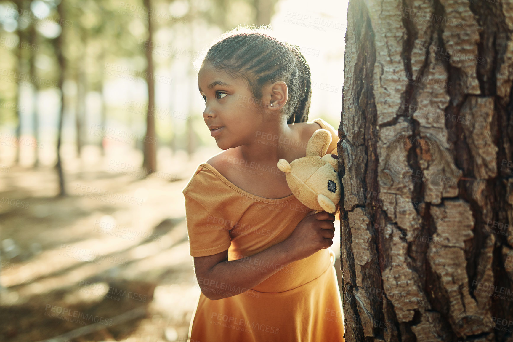 Buy stock photo Shot of a little girl playing in the woods with her teddybear