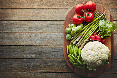 Buy stock photo Above, desk and vegetable on wood board for cooking with diet, nutrition and healthy soup. Fresh, food and home with organic or vegetarian meal for wellness, wellbeing and self care and vegan