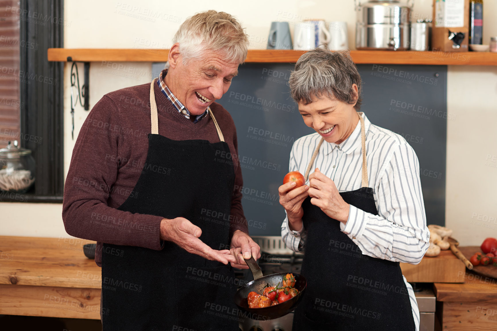 Buy stock photo Senior, couple and cooking in kitchen, healthy food and bonding in home, morning and meal . Happiness, old man and woman in house, marriage and love with care, vegetables and together for breakfast