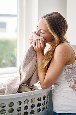 Buy stock photo Woman, housekeeping and clean laundry smell or cleaning clothes, fabric or blanket with fragrance and happy home routine. Person, fresh linen and smelling scent of detergent product or soft clothing