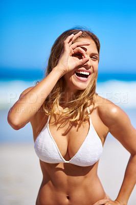 Buy stock photo Summer, smile and bikini with woman at beach for travel destination, relax and vacation in the Maldives with okay sign. Happy, sexy and tropical with girl on overseas adventure for holiday trip