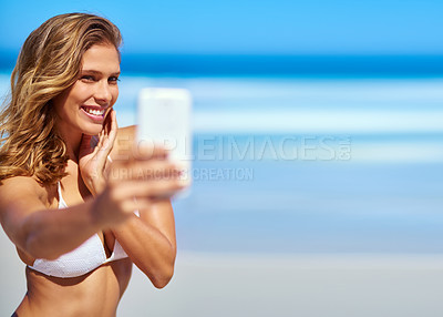 Buy stock photo Influencer, phone and woman taking a selfie at a beach for a social media audience or travel blog online in Sao Paulo, Brazil. Model, content creator or happy girl taking pictures in summer in bikini