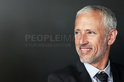 Buy stock photo Businessman, thinking and happy with a smile on face with idea and space for mockup in studio. Headshot of a senior entrepreneur person on a black background for corporate vision and career pride