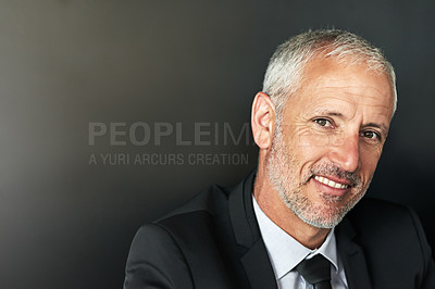 Buy stock photo Cropped shot of a handsome mature businessman in corporate attire