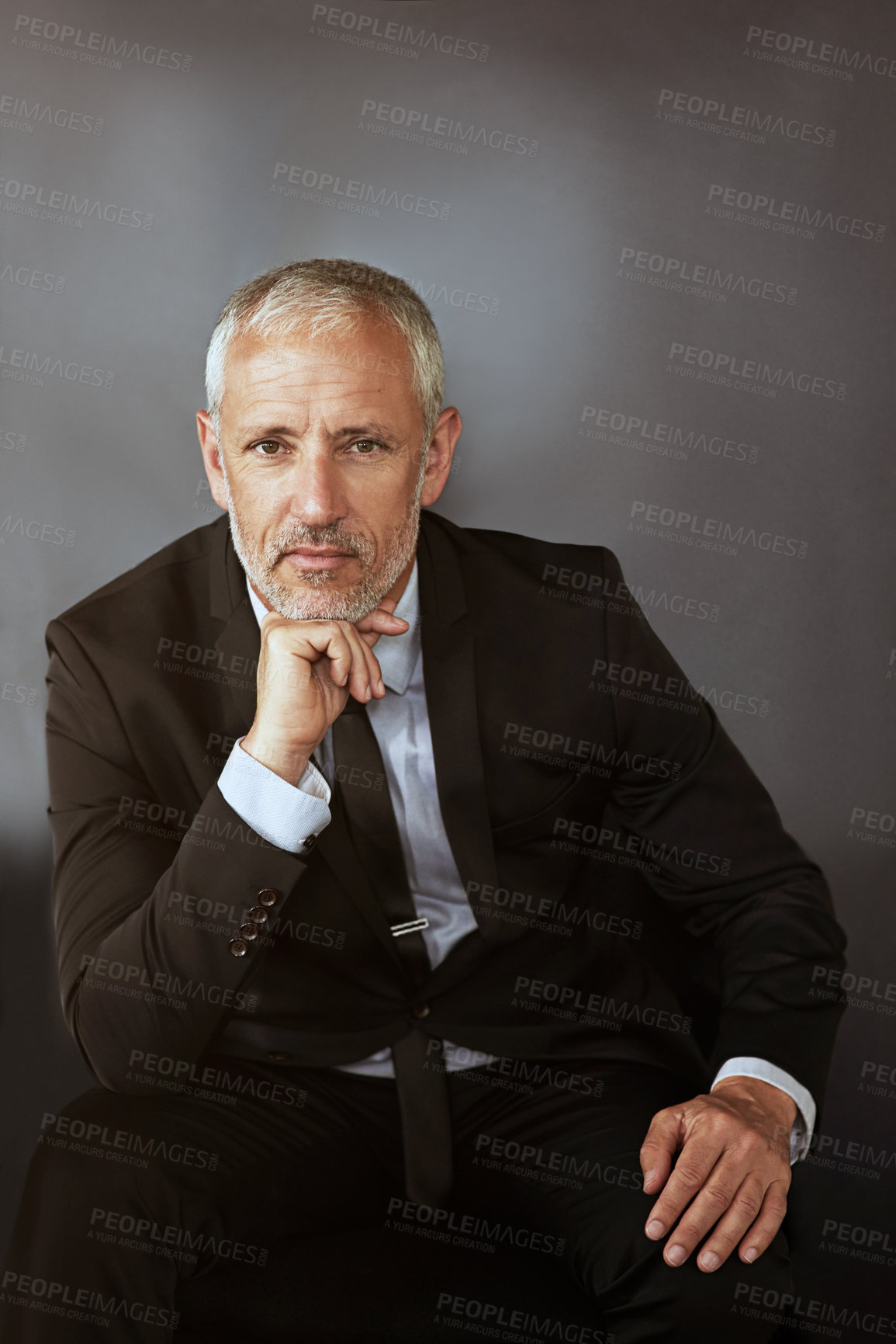 Buy stock photo Cropped shot of a handsome mature businessman in corporate attire