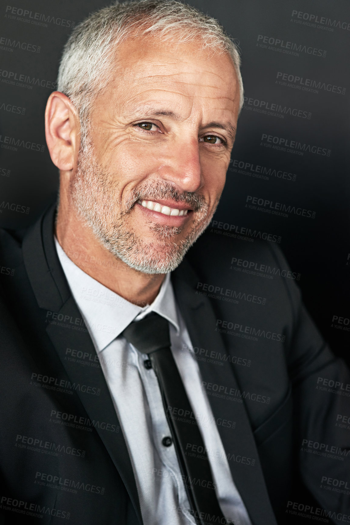 Buy stock photo Cropped shot of a handsome mature businessman in corporate attire