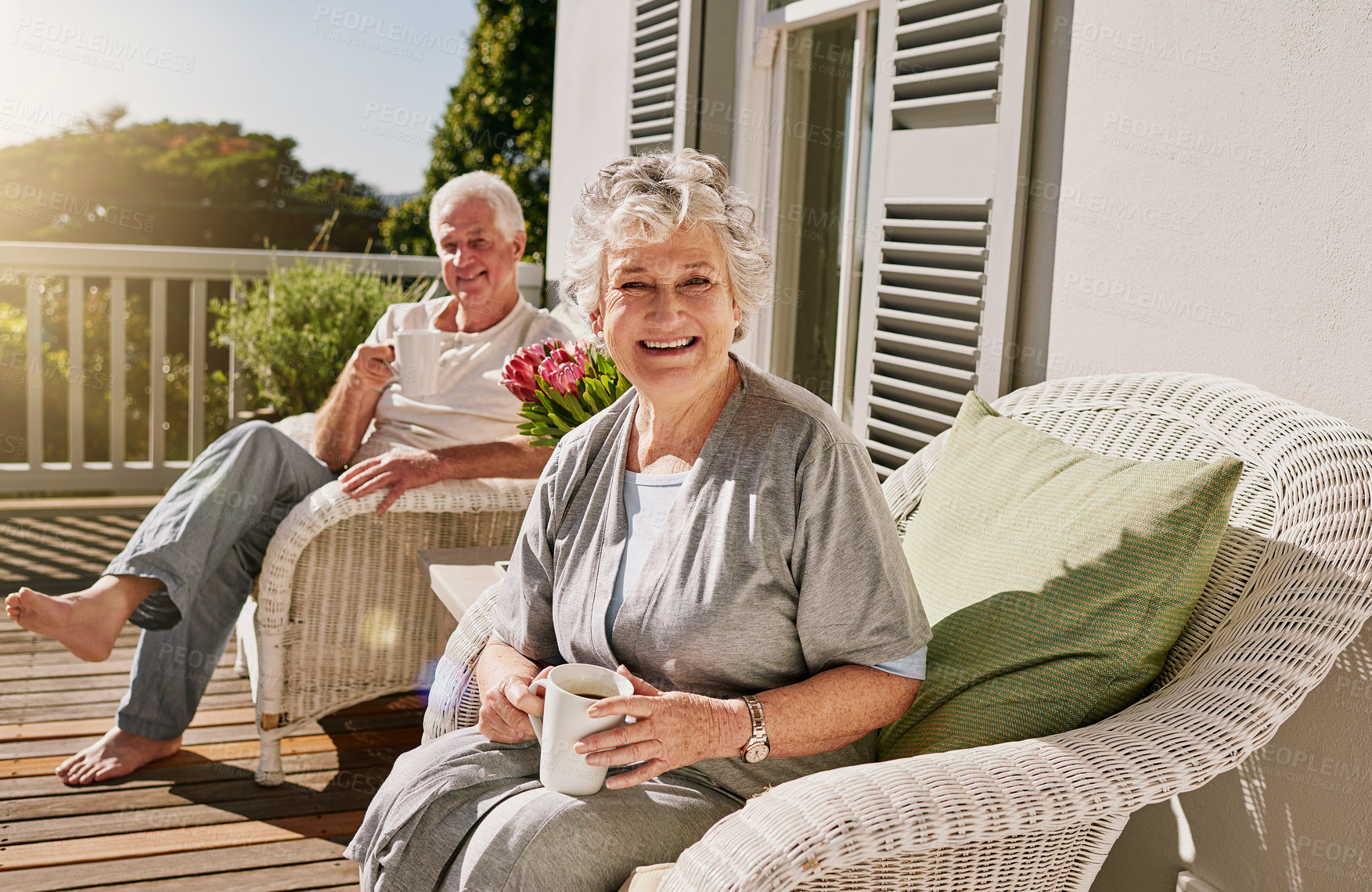 Buy stock photo Happy, patio and portrait of senior couple with coffee enjoying bonding, quality time and relax in morning. Love, retirement and elderly man and woman smile with drink for breakfast outdoors at home